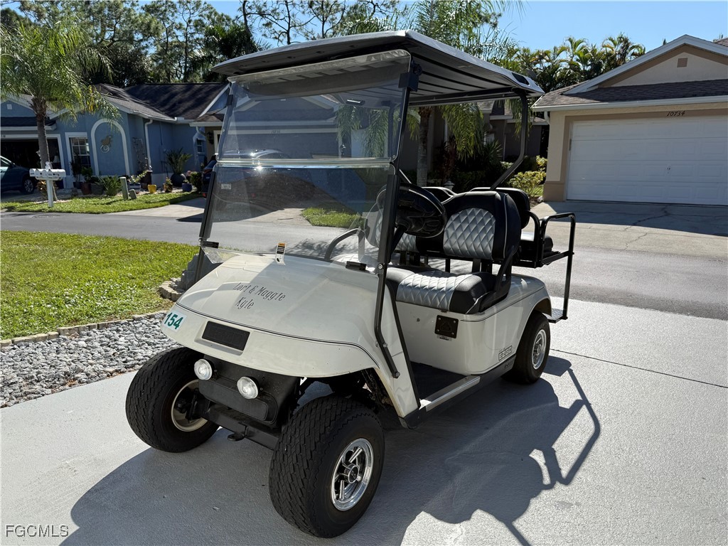 10733 Rio Mar Circle Estero, FL 33928 - Photo 39 of 40 a car parked in front of the house