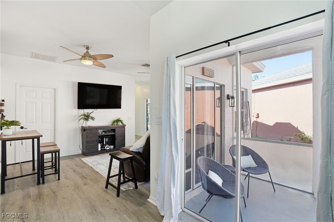 10733 Rio Mar Circle Estero, FL 33928 - Photo 8 of 40 a view of a livingroom with furniture and a flat screen tv