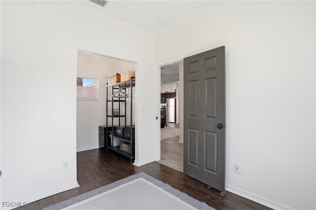 10733 Rio Mar Circle Estero, FL 33928 - Photo 10 of 40 a view of empty room with wooden floor and closet