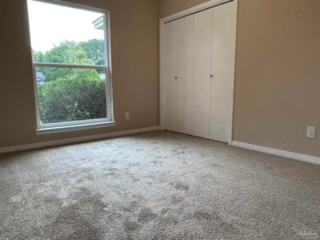 wooden floor and window in an empty room