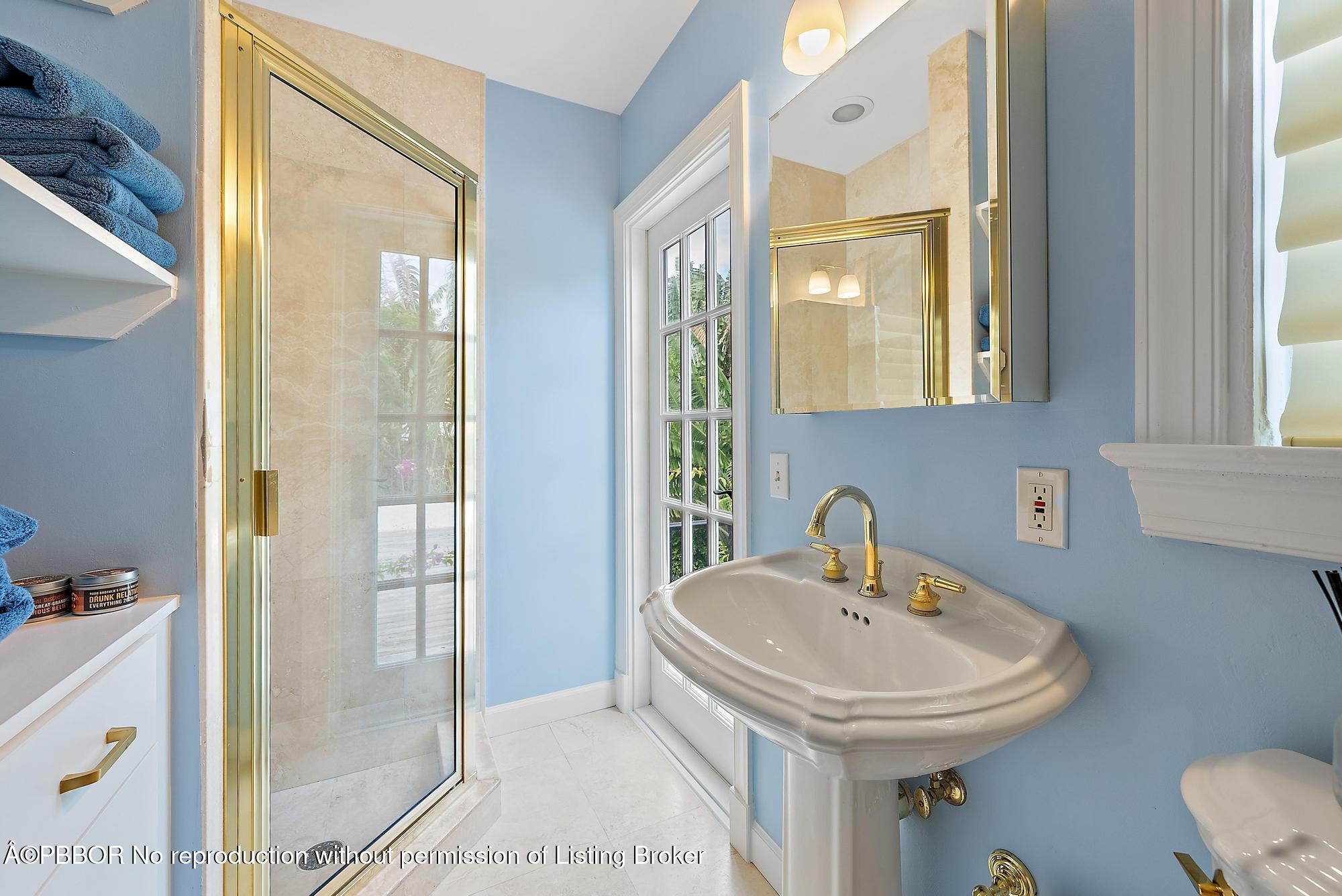 325 Seaspray Avenue Palm Beach, FL 33480 - Photo 13 of 14 a bathroom with a sink and a mirror