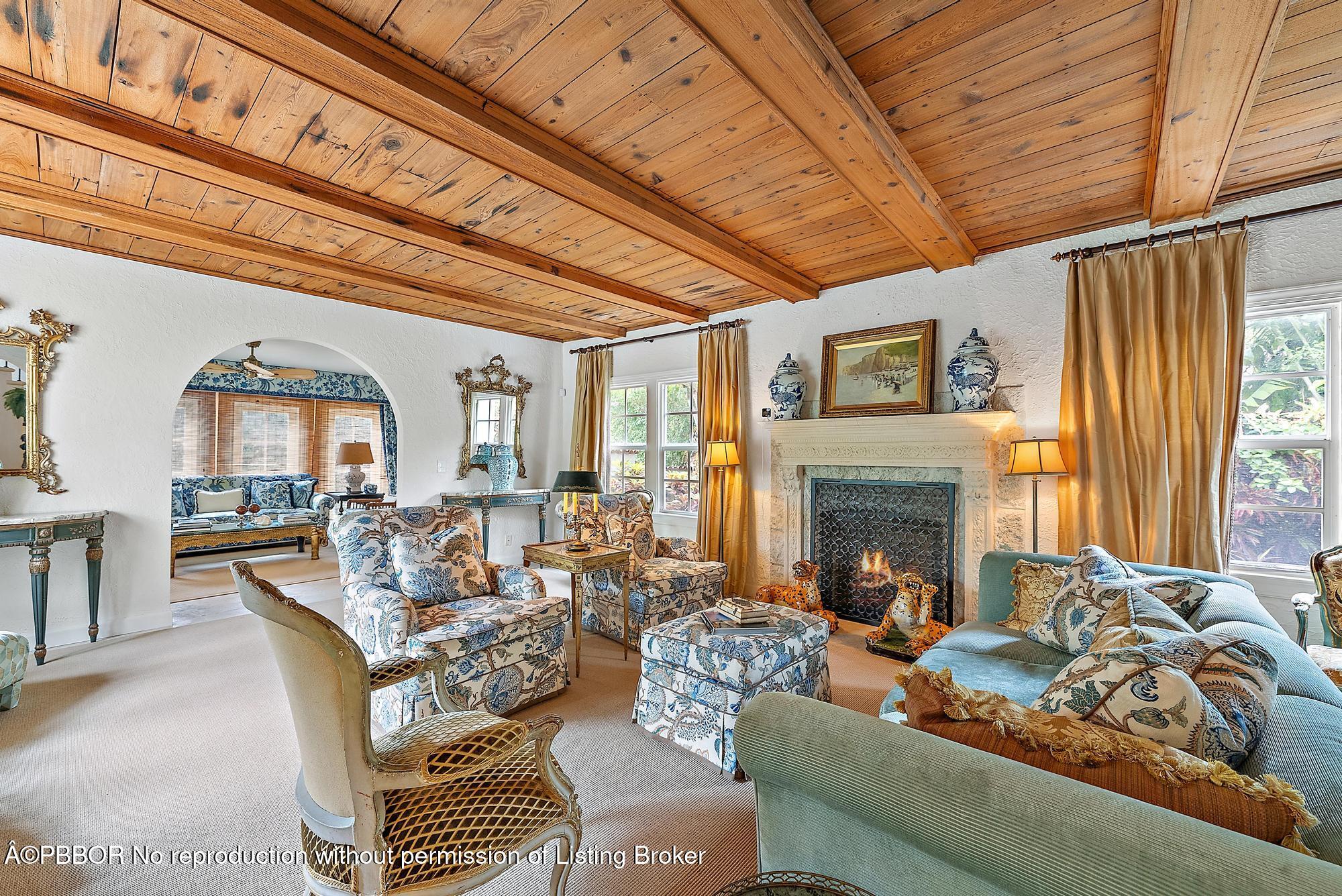 325 Seaspray Avenue Palm Beach, FL 33480 - Photo 3 of 14 a living room with furniture and a fireplace