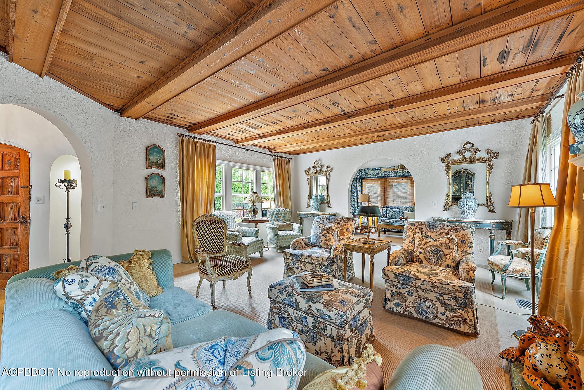 325 Seaspray Avenue Palm Beach, FL 33480 - Photo 4 of 14 a living room with furniture and a large window