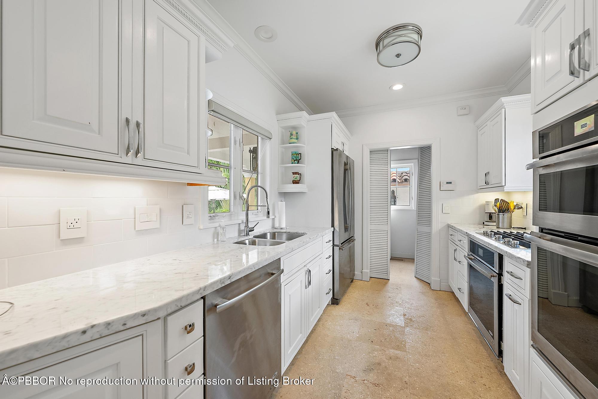 325 Seaspray Avenue Palm Beach, FL 33480 - Photo 5 of 14 a kitchen with stainless steel appliances granite countertop a sink stove and refrigerator