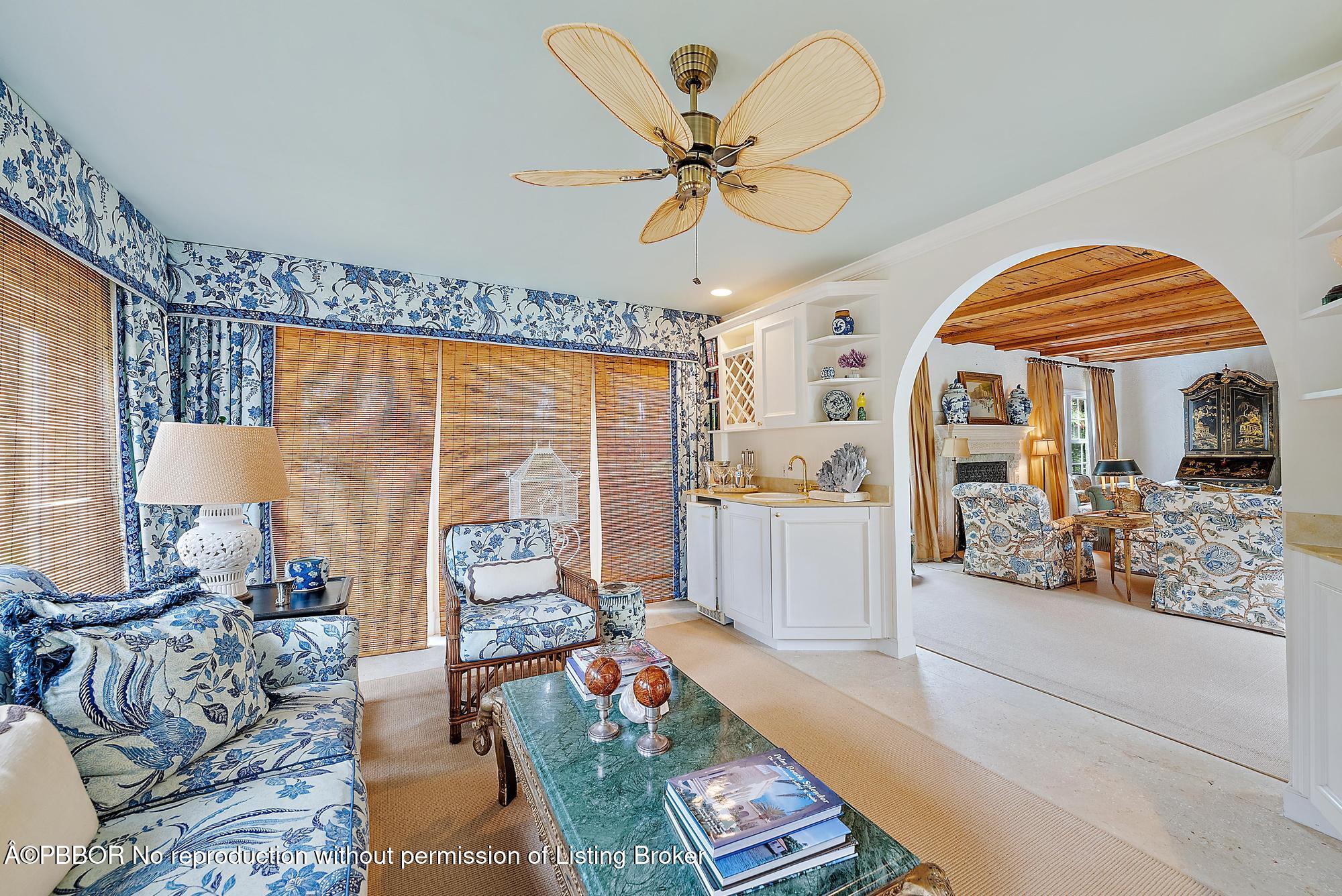 325 Seaspray Avenue Palm Beach, FL 33480 - Photo 8 of 14 a living room with furniture a fireplace and a chandelier