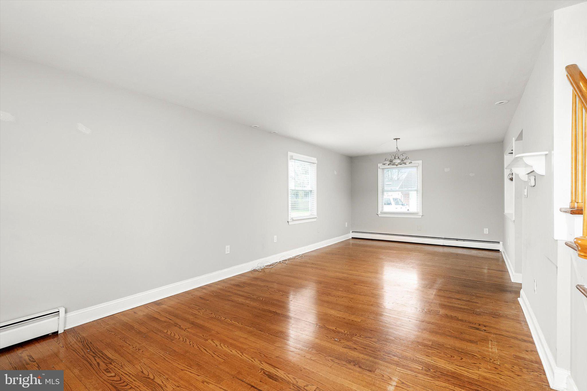 446 Trinity Avenue Hamilton, NJ 08619 - Photo 11 of 31 a view of an empty room with wooden floor and window