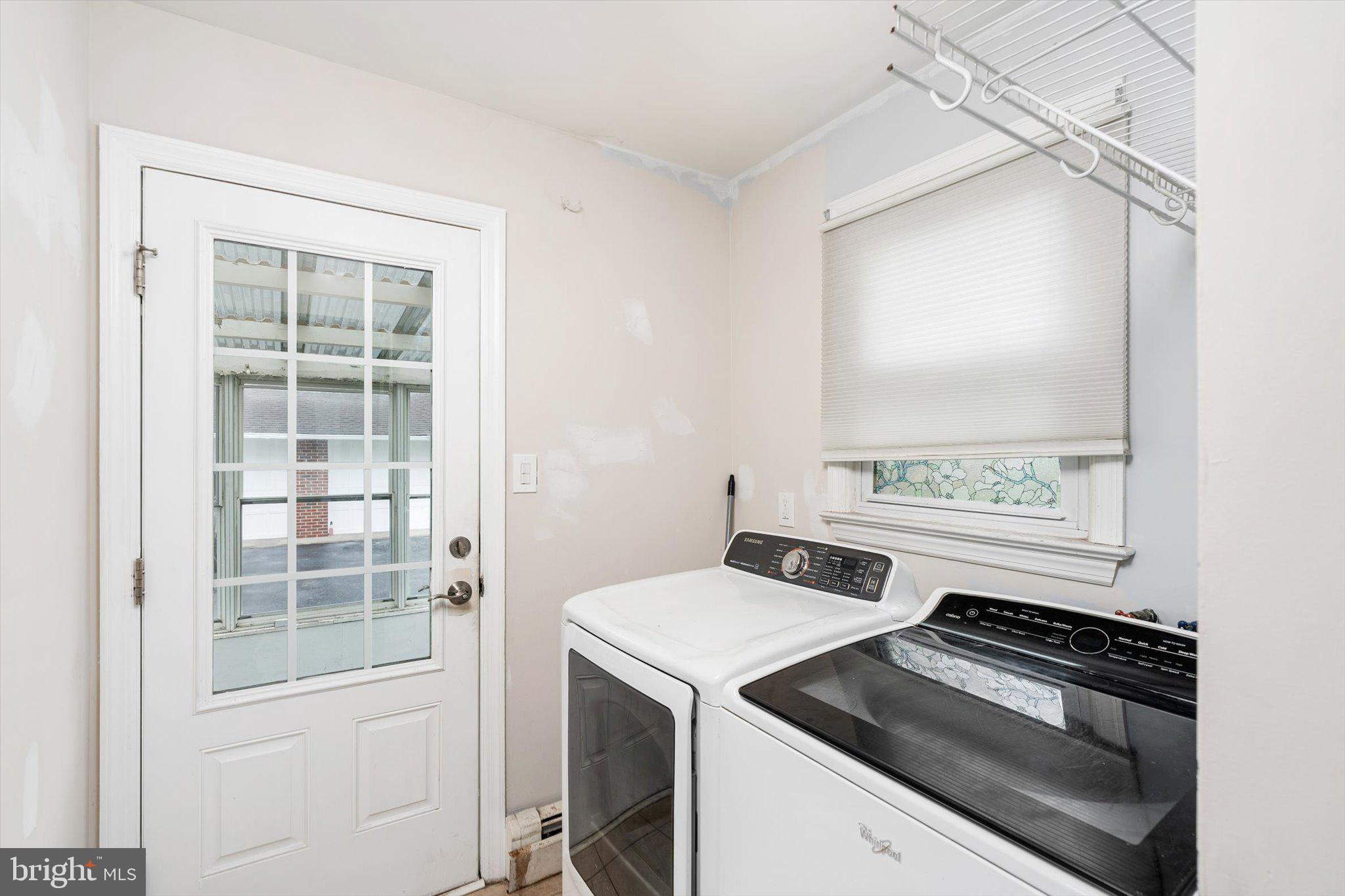 446 Trinity Avenue Hamilton, NJ 08619 - Photo 14 of 31 a view of a kitchen with a stove wooden floor and a window