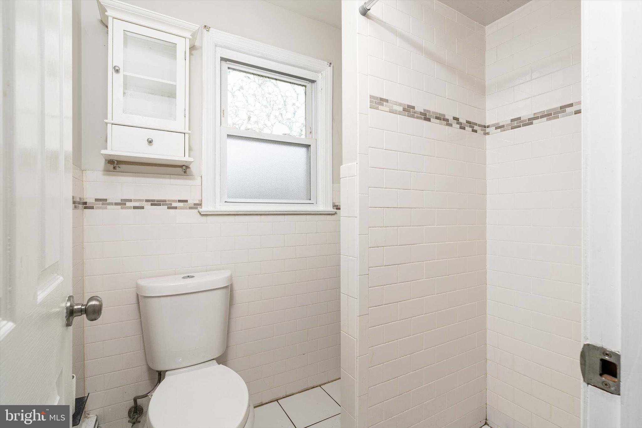 446 Trinity Avenue Hamilton, NJ 08619 - Photo 15 of 31 a bathroom with a toilet and a shower