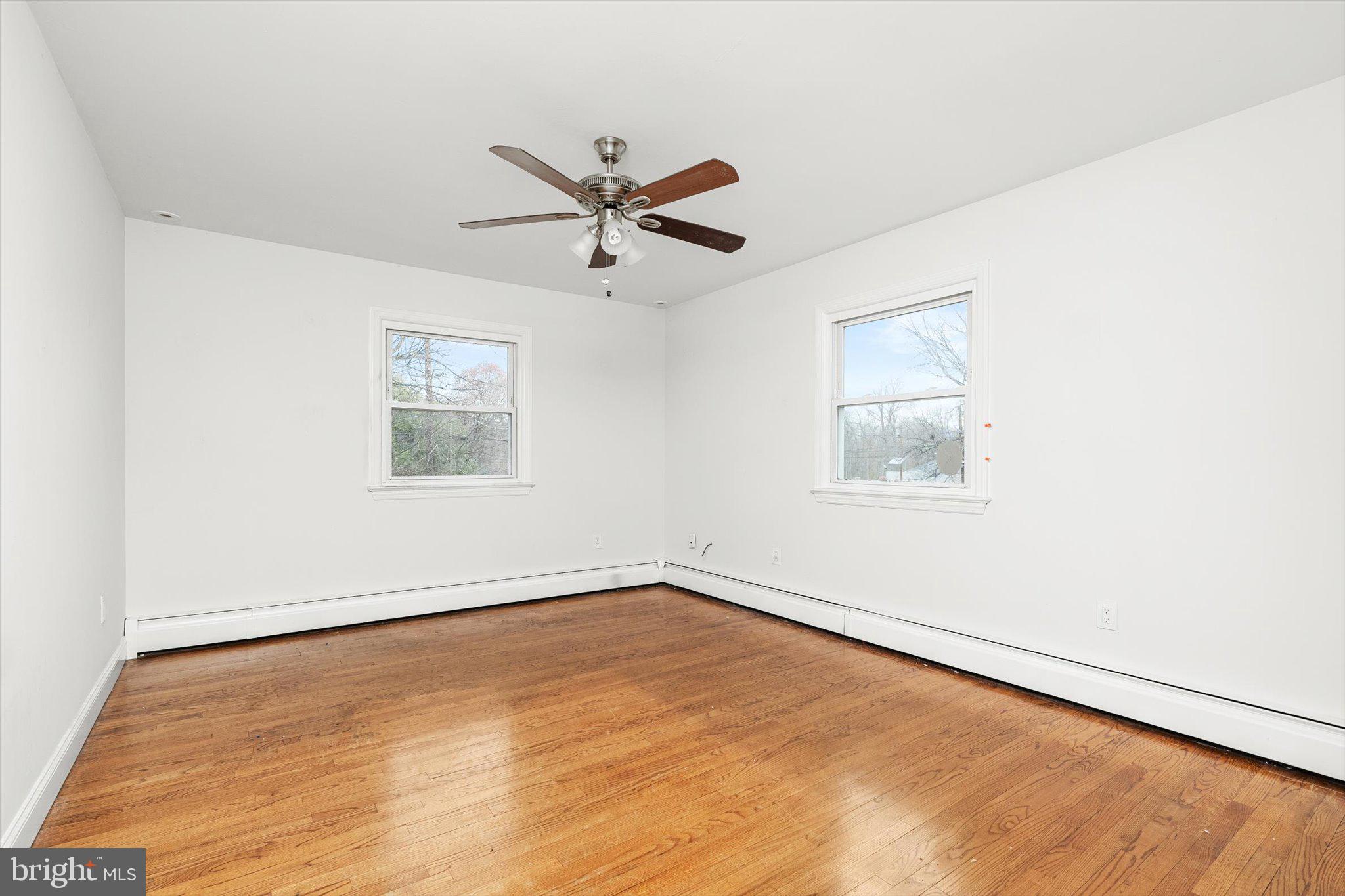 446 Trinity Avenue Hamilton, NJ 08619 - Photo 17 of 31 an empty room with a window and a ceiling fan
