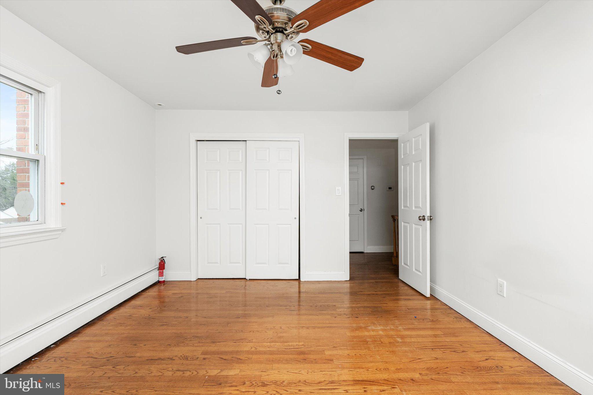 446 Trinity Avenue Hamilton, NJ 08619 - Photo 18 of 31 a view of an empty room with window and a ceiling fan