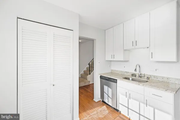a kitchen with a sink and cabinets