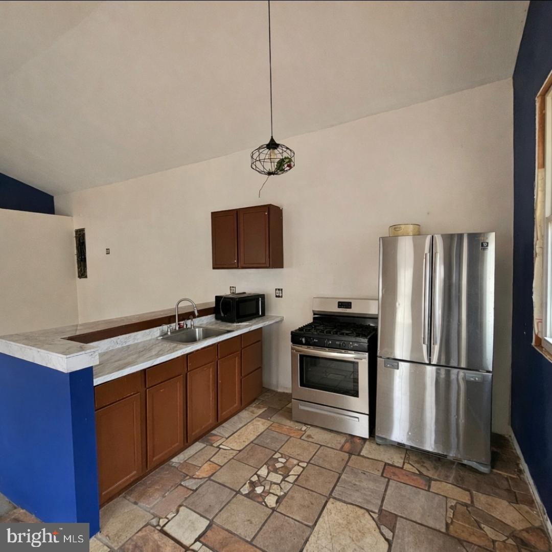 345 Jute Road Millville, NJ 08332 - Photo 11 of 18 a kitchen with a sink stainless steel appliances and cabinets