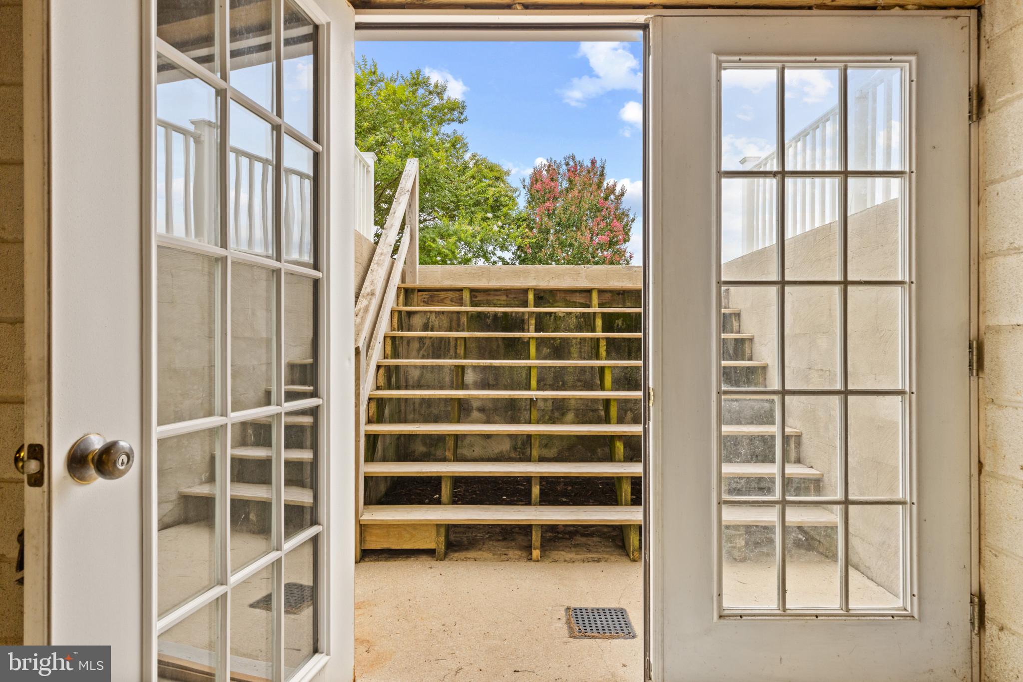203 Beck Farm Road Centreville, MD 21617 - Photo 33 of 46 French doors in Basement lead to walk-up stairs