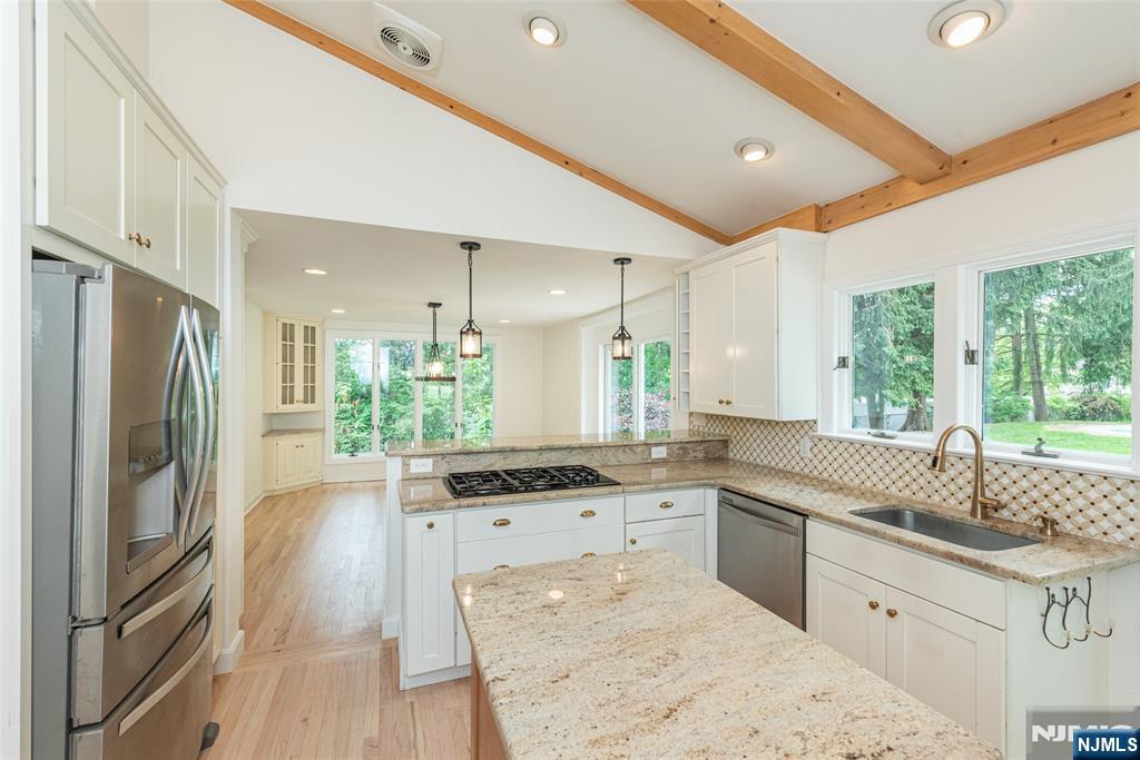 163 Sand Spring Road Morristown, NJ 07960 - Photo 5 of 39 a kitchen with stainless steel appliances granite countertop a sink stove and refrigerator