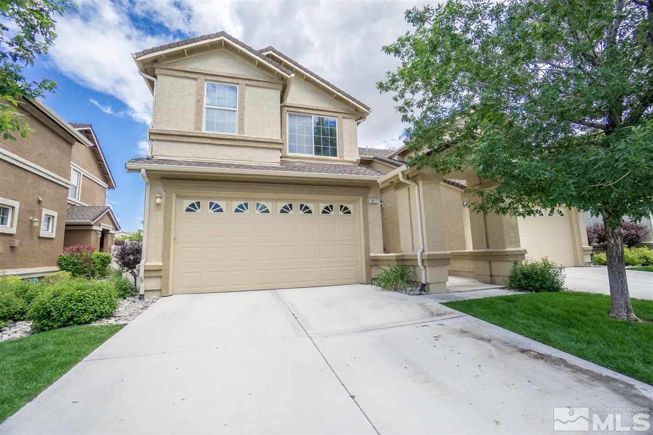 1817 Resistol Drive Reno, NV 89521 - Photo 1 of 25 a front view of a house with a yard and garage