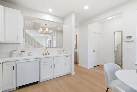 a bathroom with a double vanity sink mirror and