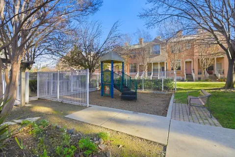 a view of a building with a yard