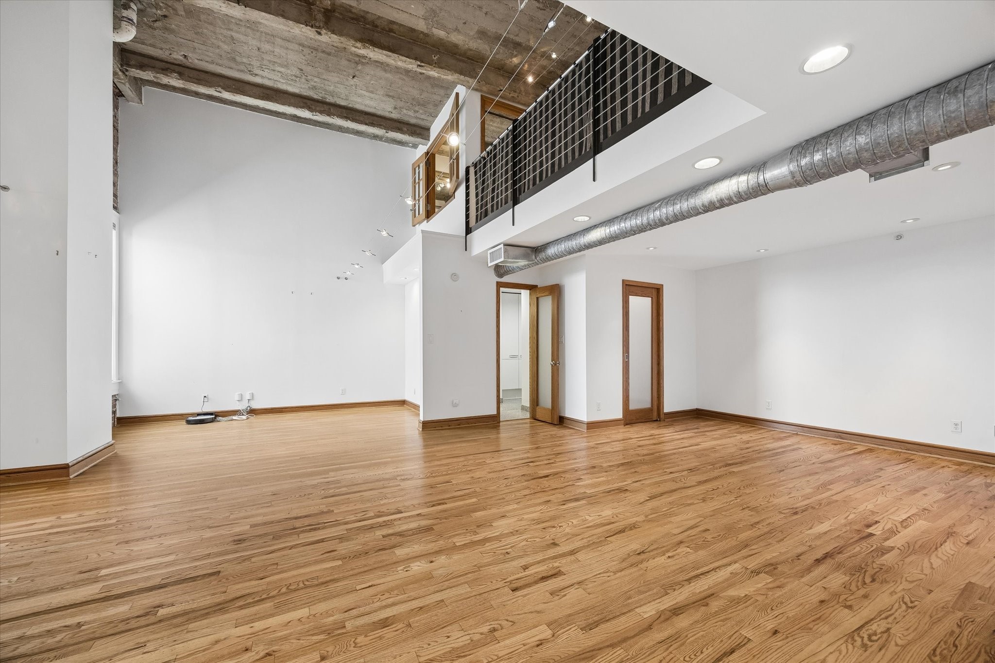915 Franklin Street, Unit 9L Houston, TX 77002 - Photo 14 of 50 Additional view of the open-concept loft showcasing the living area and bedroom.