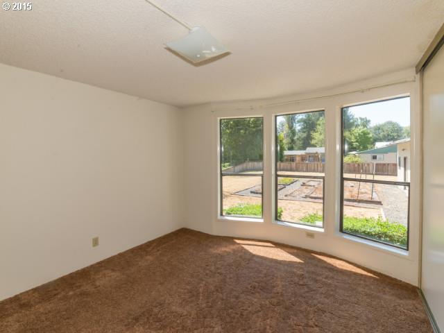 39378 Jasper Lowell Road Lowell, OR 97452 - Photo 11 of 16 a view of an empty room with a window