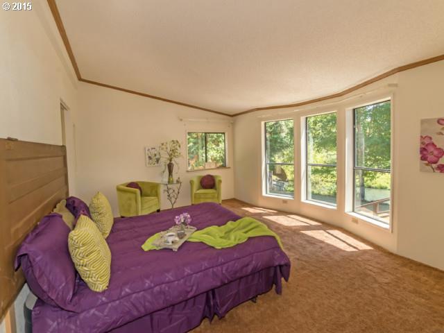39378 Jasper Lowell Road Lowell, OR 97452 - Photo 8 of 16 a bedroom with a bed and wooden floor