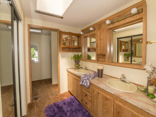 39378 Jasper Lowell Road Lowell, OR 97452 - Photo 9 of 16 a bathroom with a sink and a mirror