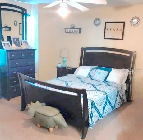 a bed room with a bed and a dresser
