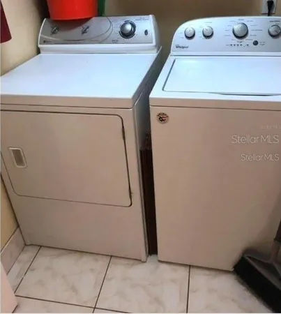 a utility room with dryer and washer