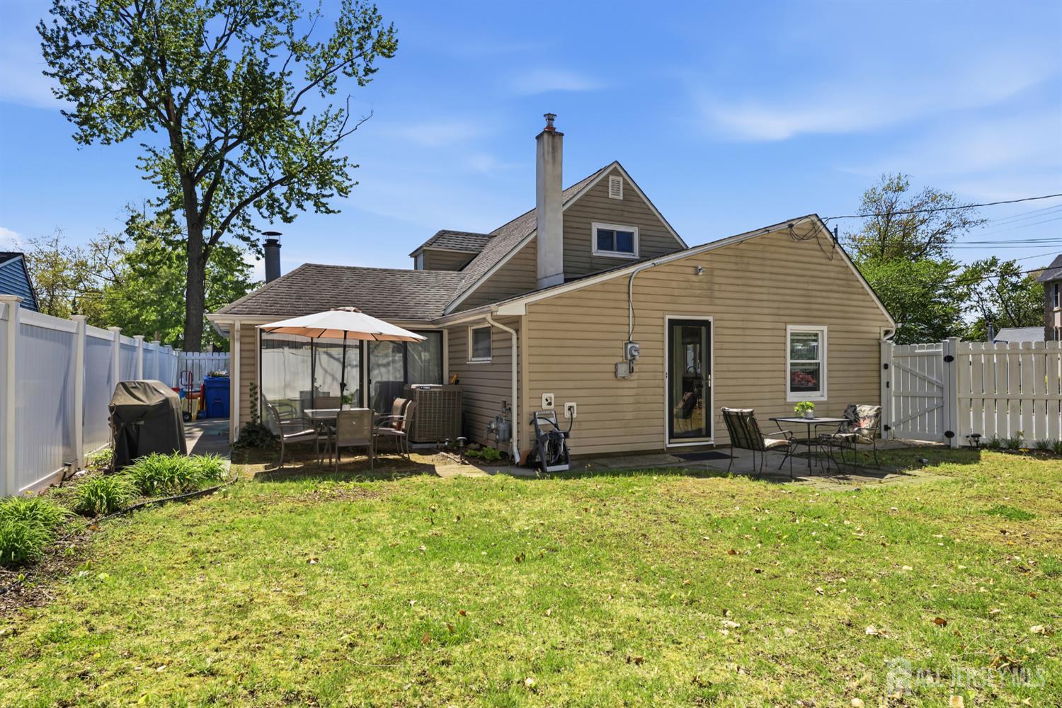 14 Sunrise Road Old Bridge, NJ 08857 - Photo 11 of 32 a view of a house with backyard and sitting area
