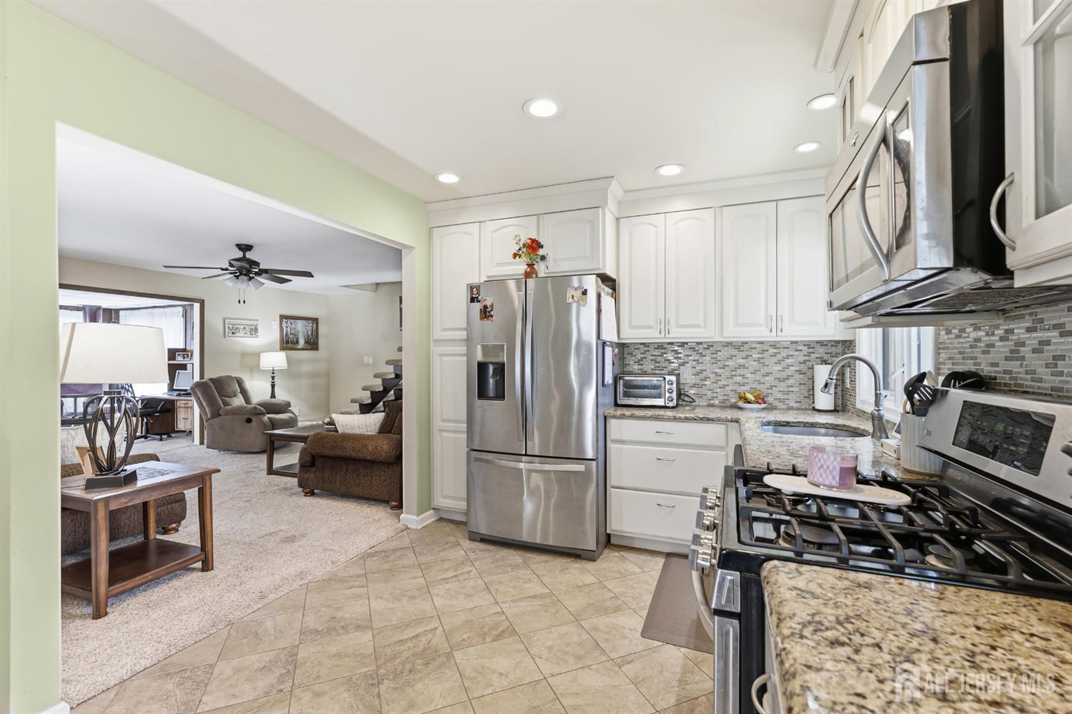 14 Sunrise Road Old Bridge, NJ 08857 - Photo 16 of 32 a kitchen with refrigerator and cabinets