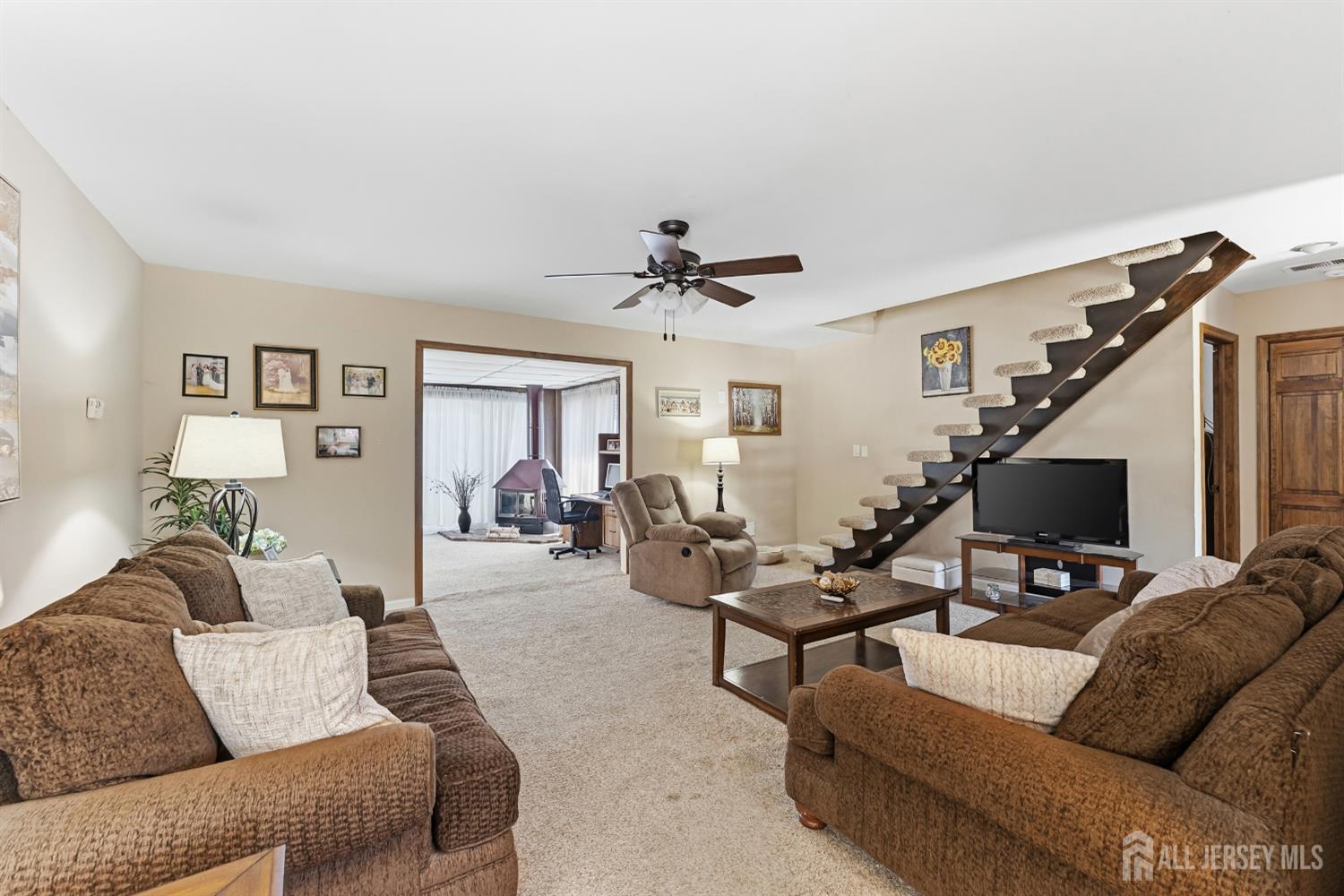 14 Sunrise Road Old Bridge, NJ 08857 - Photo 17 of 32 a living room with furniture and a flat screen tv