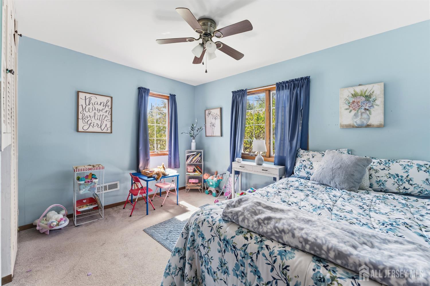 14 Sunrise Road Old Bridge, NJ 08857 - Photo 21 of 32 a bedroom with a bed and a chandelier