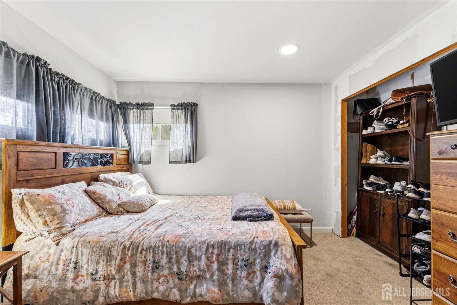 14 Sunrise Road Old Bridge, NJ 08857 - Photo 24 of 32 a bedroom with a large bed and a closet