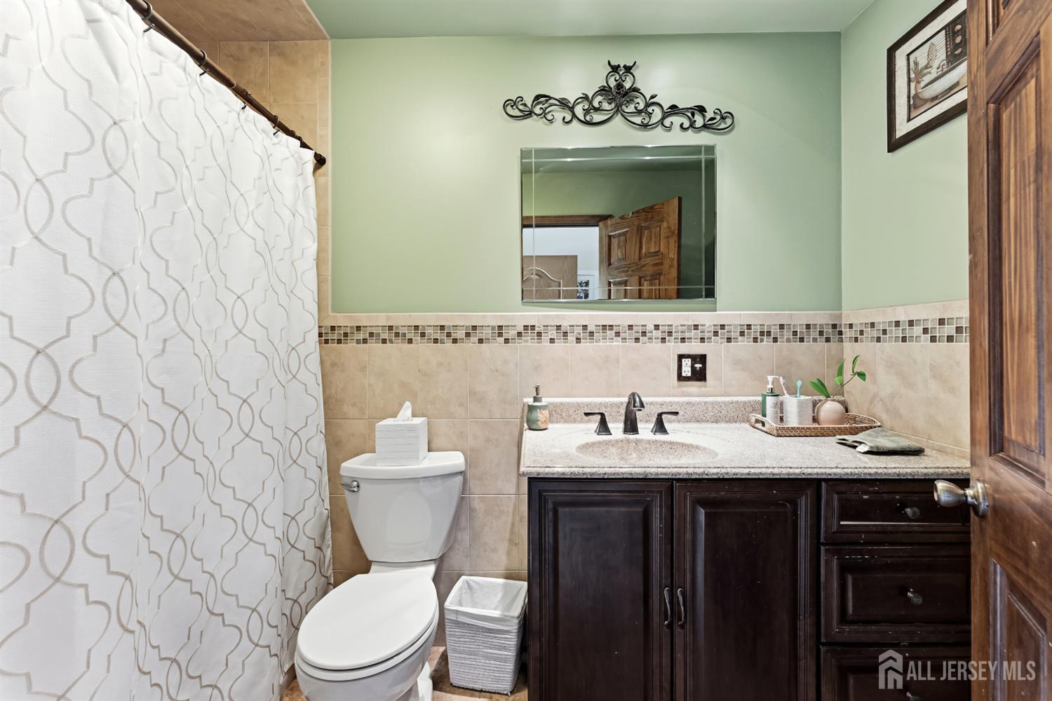 14 Sunrise Road Old Bridge, NJ 08857 - Photo 25 of 32 a bathroom with a toilet sink and mirror