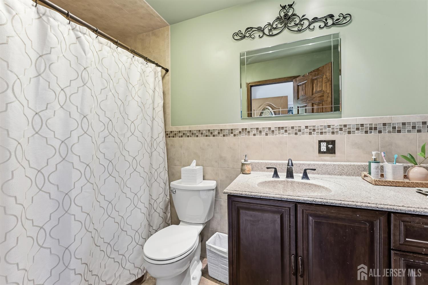 14 Sunrise Road Old Bridge, NJ 08857 - Photo 26 of 32 a bathroom with a sink vanity mirror and toilet