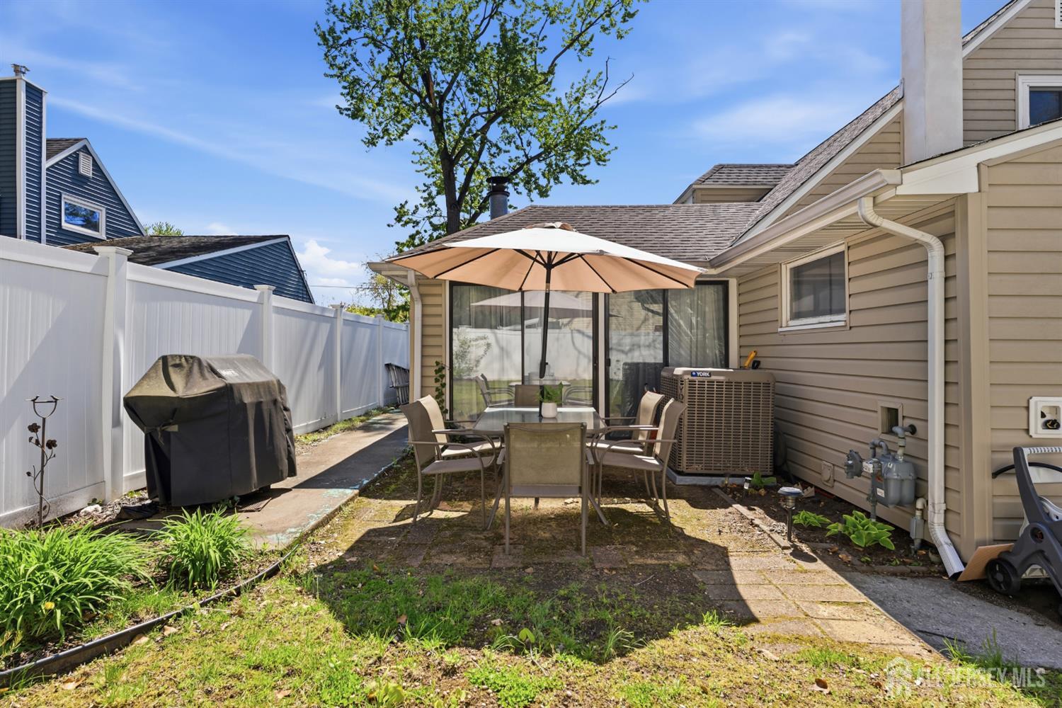 14 Sunrise Road Old Bridge, NJ 08857 - Photo 31 of 32 a view of a patio with chairs and plants