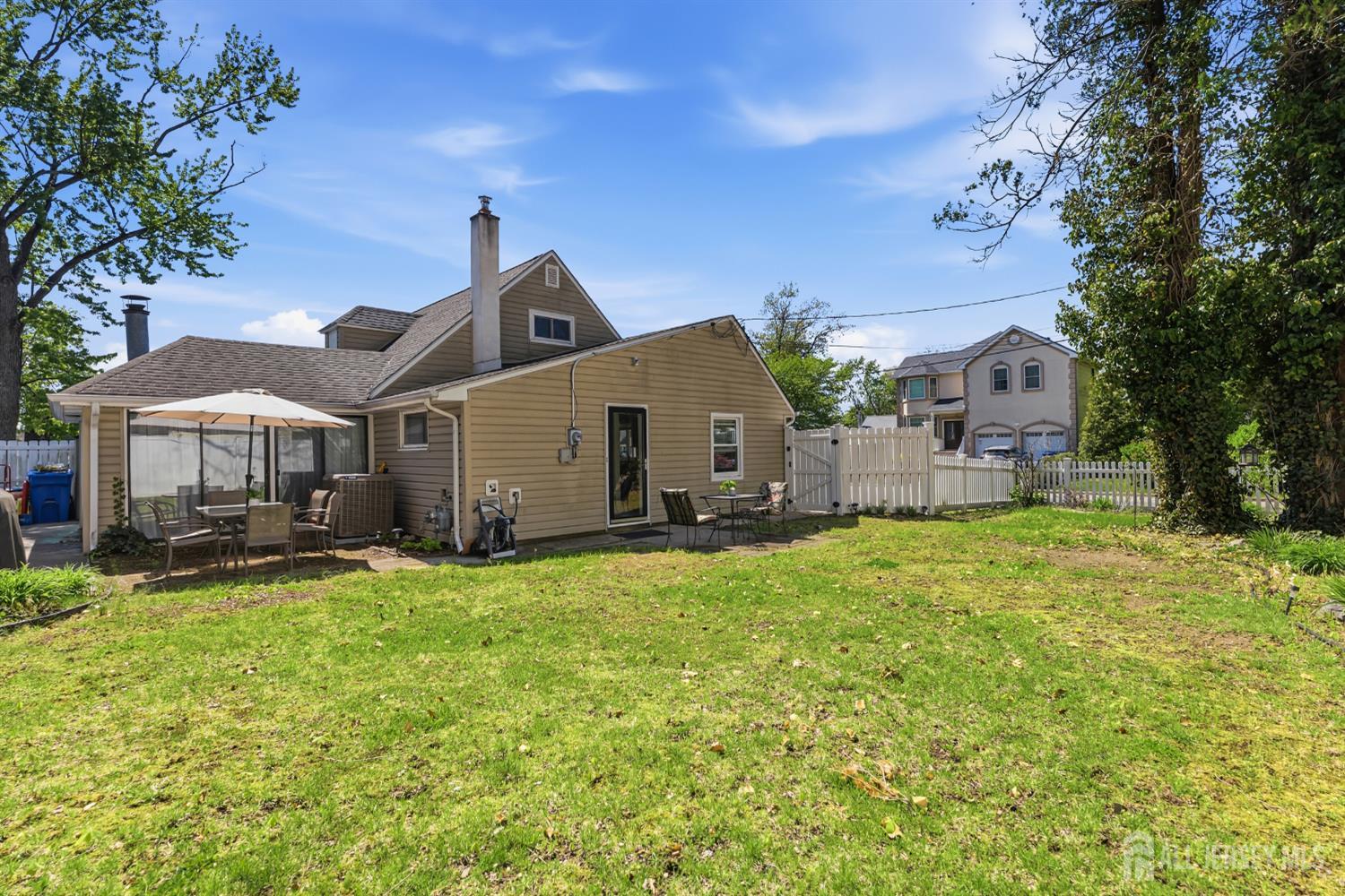 14 Sunrise Road Old Bridge, NJ 08857 - Photo 10 of 32 a front view of a house with a yard and garage