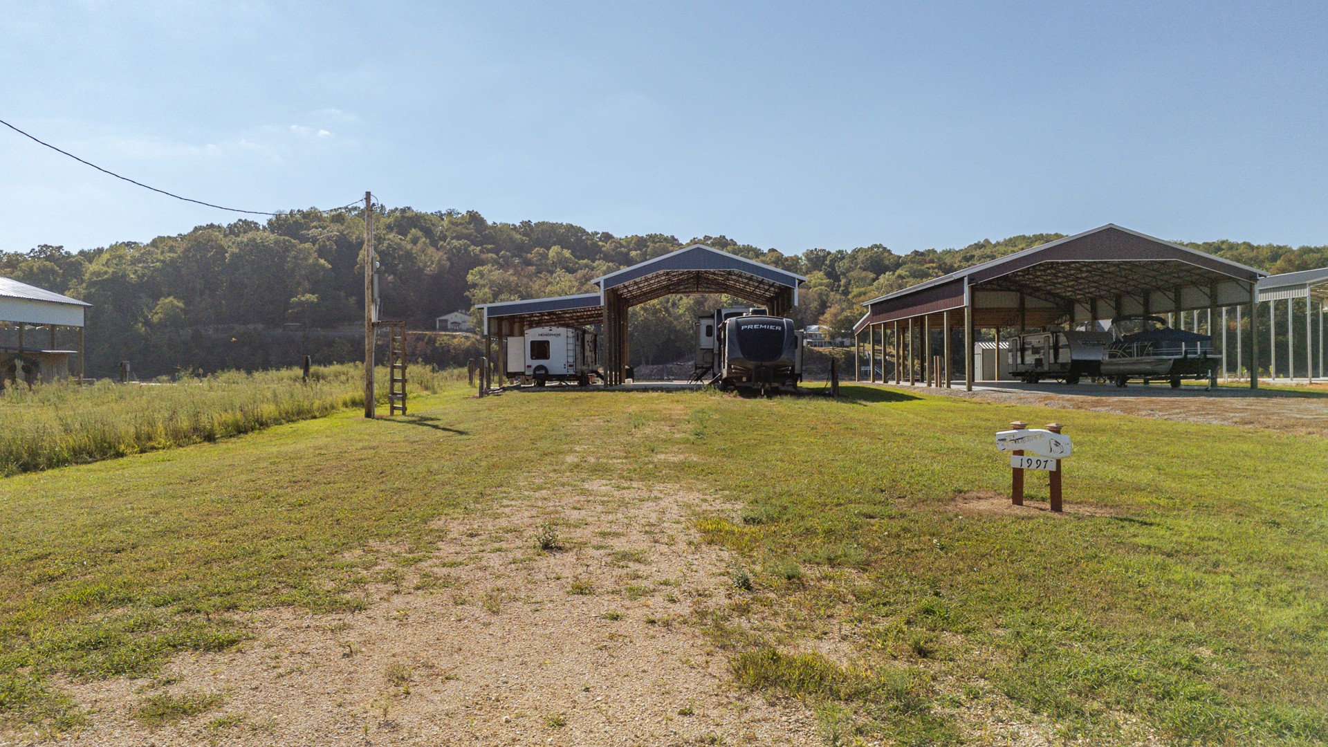 1997 Hardin Bottom River Road Clifton, TN 38425 - Photo 44 of 50 a front view of house with yard and trees