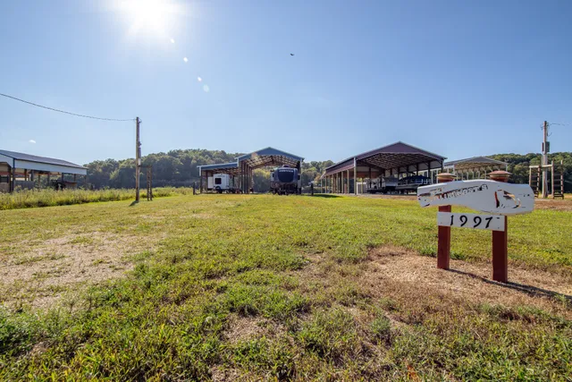 a view of a swimming pool with a yard and mountain view