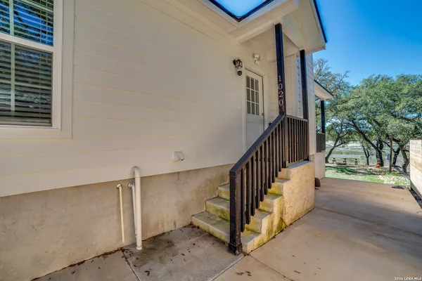 a view of a hallway with staircase