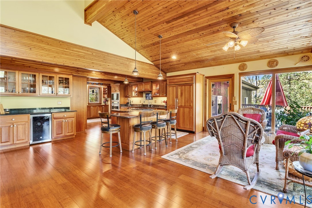 176 Baypointe Court Reedville, VA 22539 - Photo 27 of 60 a dining hall with stainless steel appliances granite countertop a stove and cabinets with wooden floor