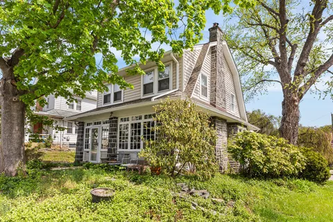 front view of a house with a yard