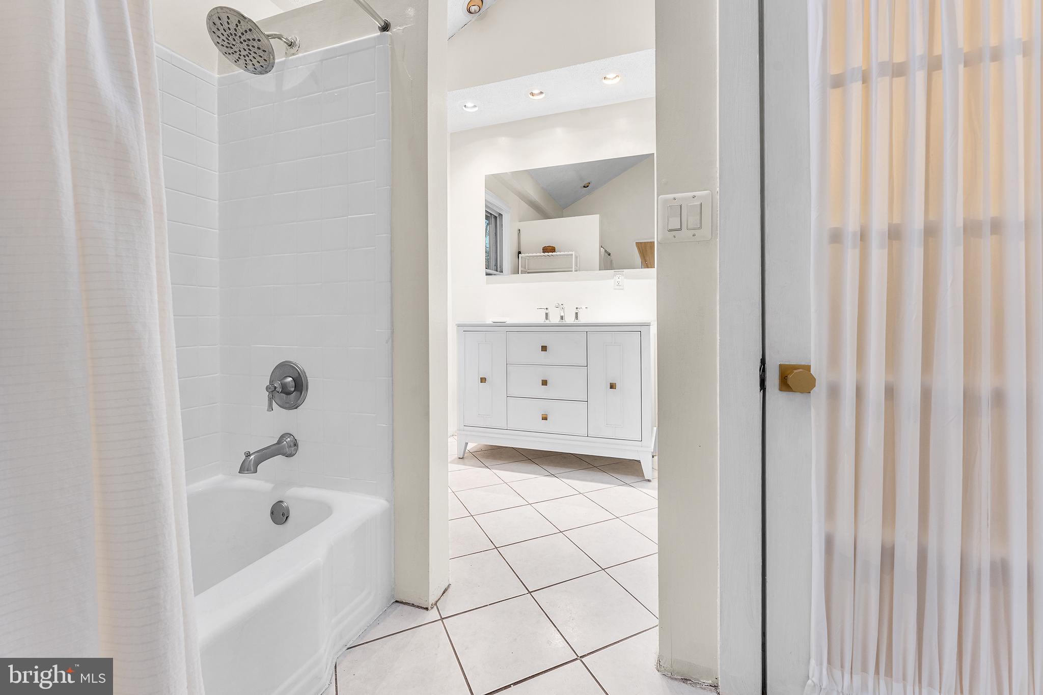 117 Foster Avenue Upper Darby, PA 19082 - Photo 18 of 30 a bathroom with a bathtub and a shower
