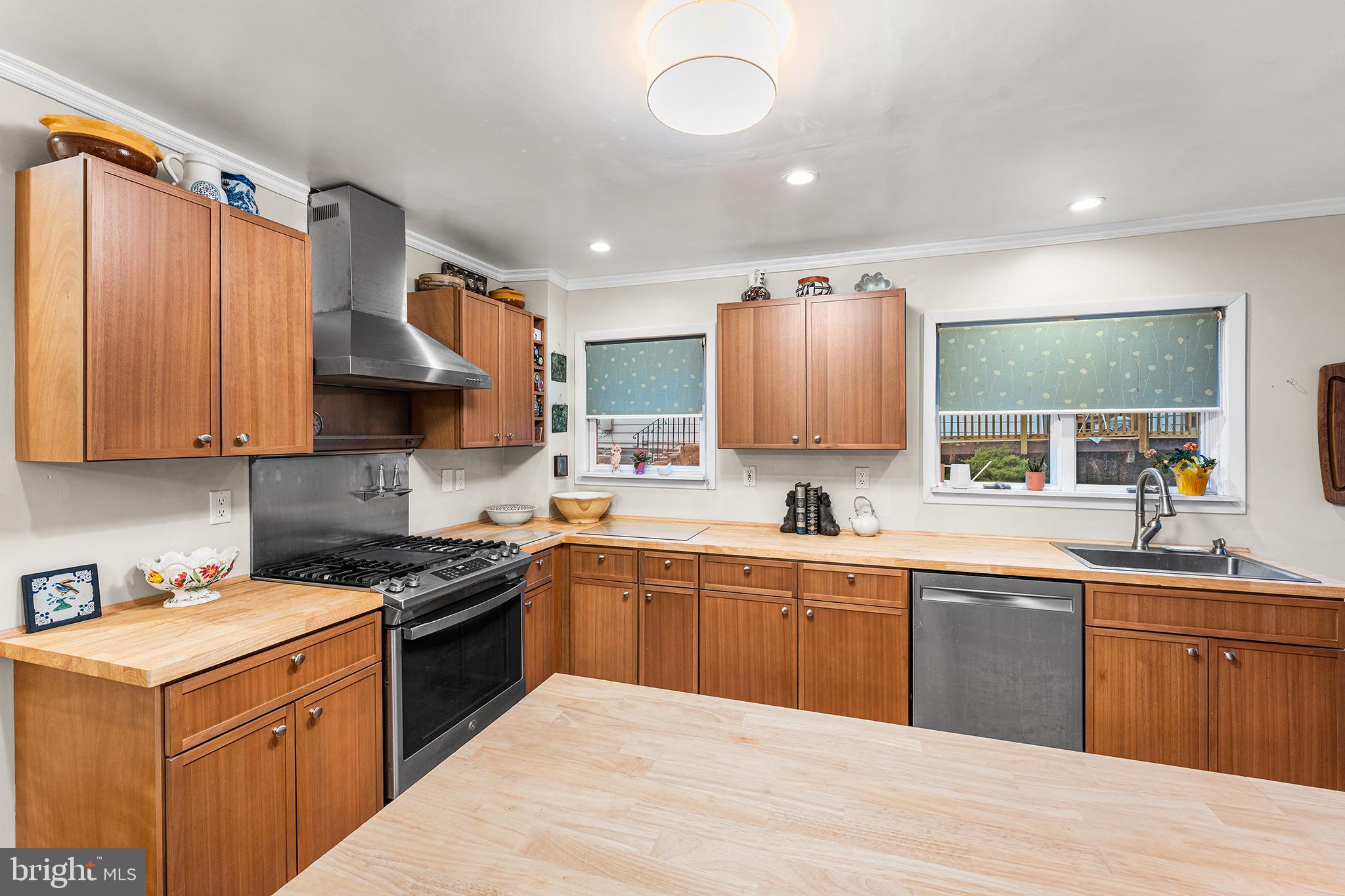 117 Foster Avenue Upper Darby, PA 19082 - Photo 25 of 30 a kitchen with a sink a stove and cabinets