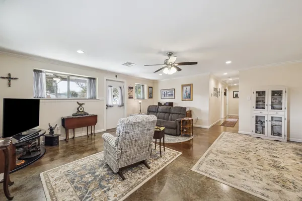 a living room with furniture and a flat screen tv