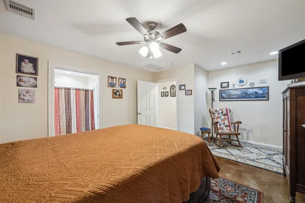 a bed room with a bed and a television