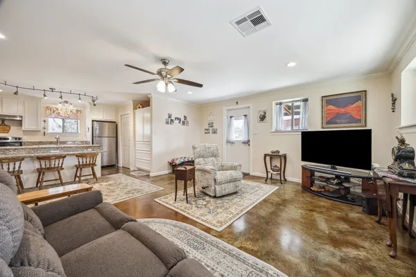 a living room with furniture and a flat screen tv