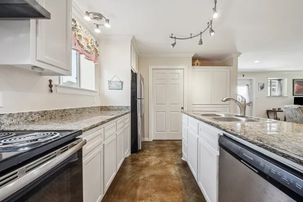 a kitchen with a stove and a sink