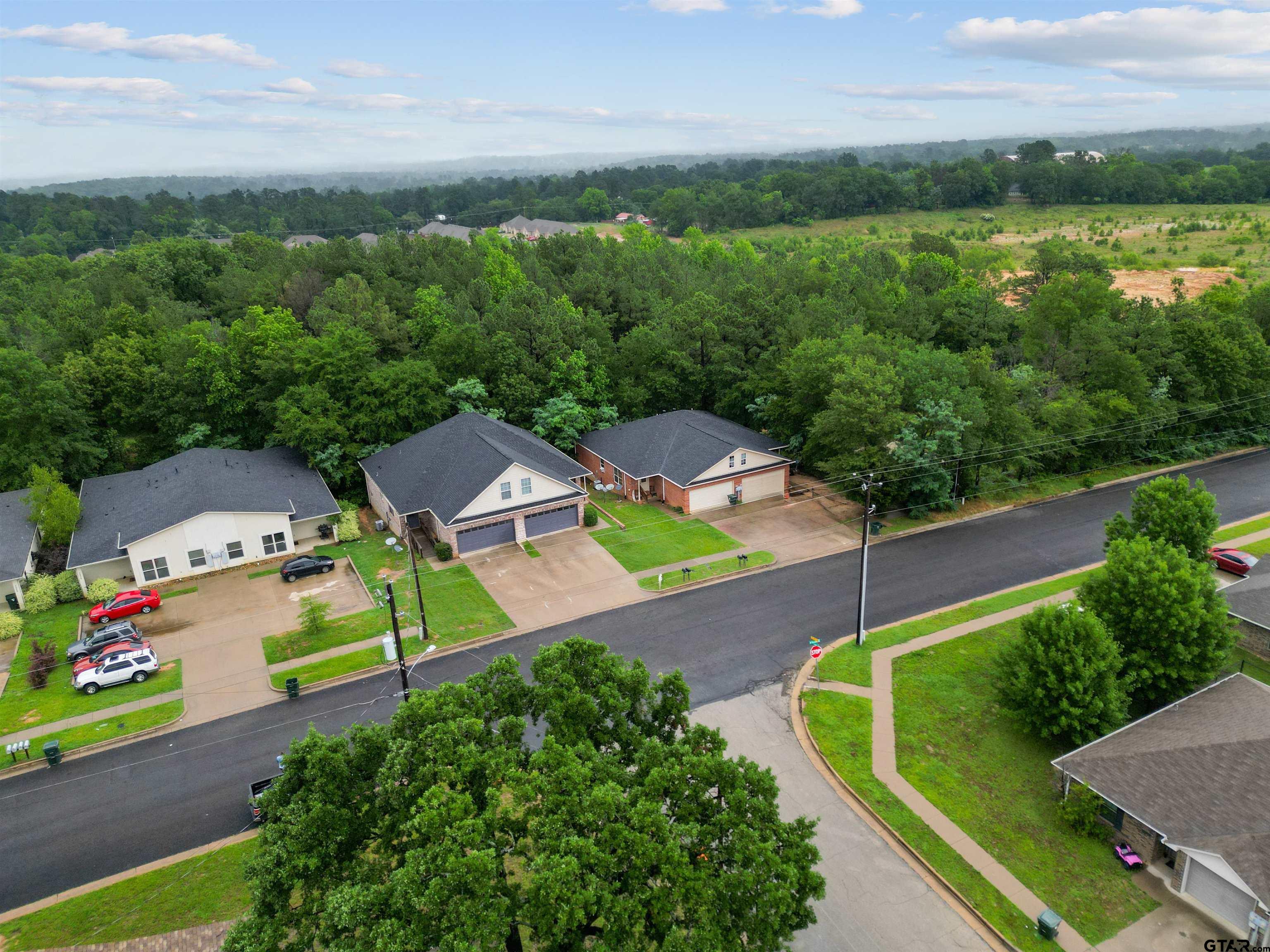 3962-3966 McDonald Road Tyler, TX 75701 - Photo 4 of 5 an aerial view of a house with garden space and street view