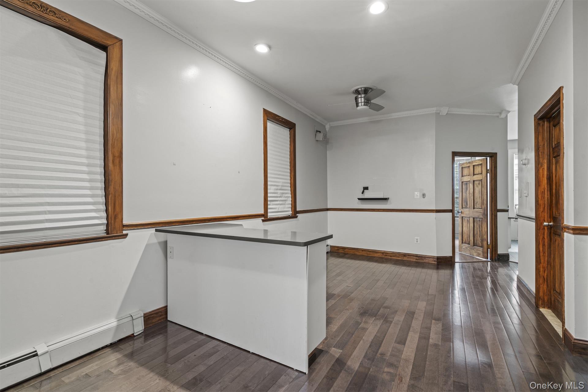 44 Decatur Street Brooklyn, NY 11216 - Photo 11 of 21 a view of a hallway with wooden floor and staircase