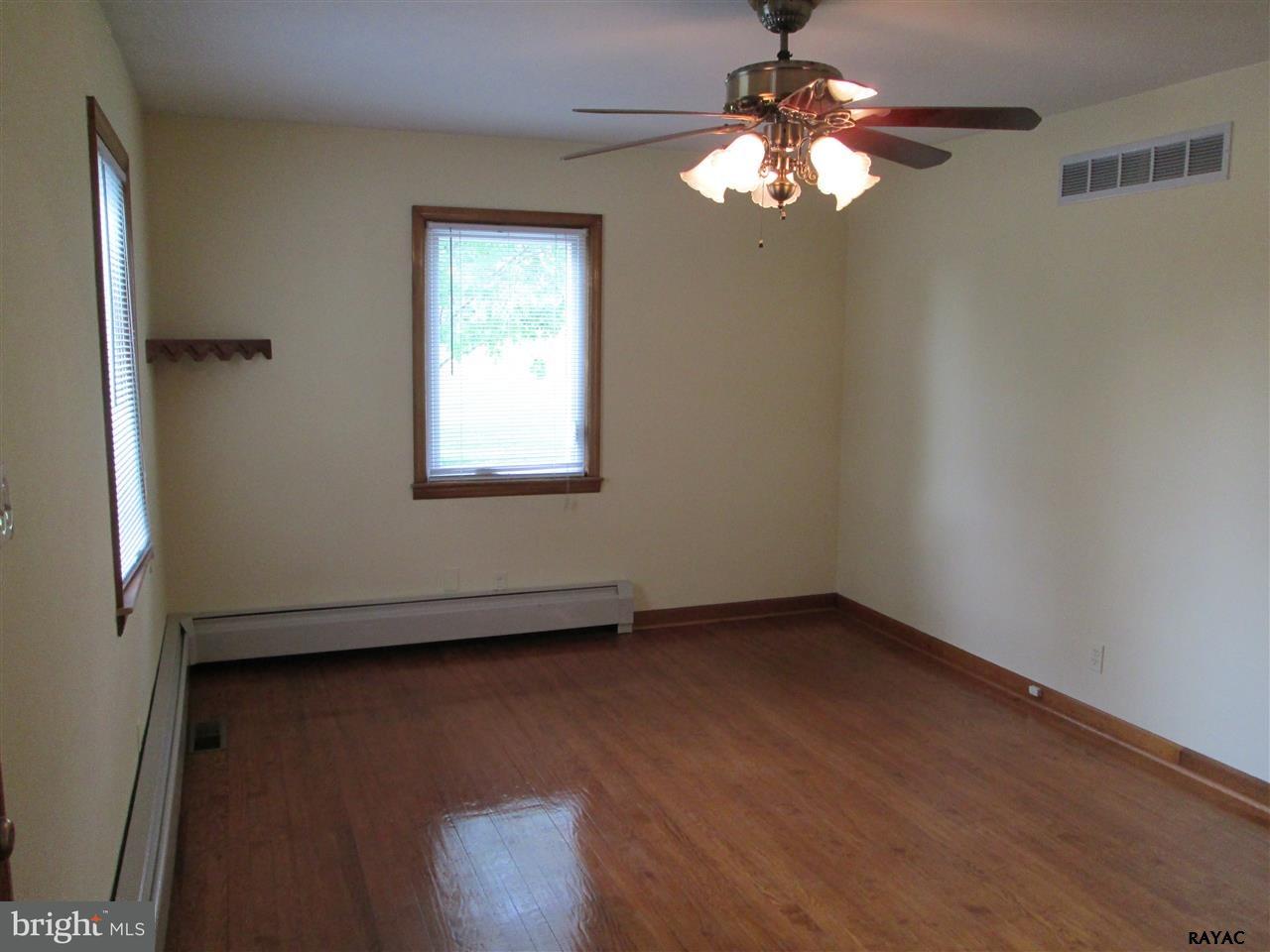 881 Pine Grove Road Hanover, PA 17331 - Photo 12 of 35 wooden floor in an empty room with a window